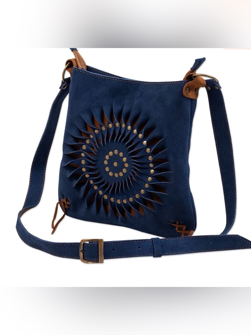 Blue suede shoulder bag, spiraling cutout, with bronze-colored metal studs